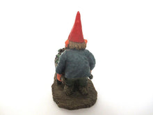 'Christian' Gnome figurine transporting grapes with a wheelbarrow.  Classic gnomes series after a design by Rien Poortvliet.