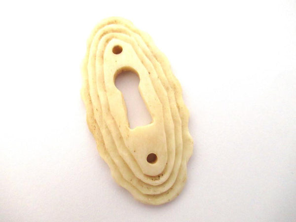 UpperDutch:Keyhole cover,Bone Keyhole cover, plate, bone escutcheon, keyhole frame.