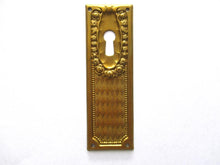1 (ONE) Keyhole cover, Brass Stamped Floral Escutcheon, keyhole plate, with roses.