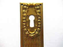 1 (ONE) Keyhole cover, Brass Stamped Floral Escutcheon, keyhole plate, with roses.