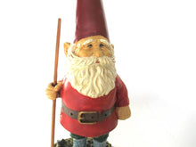 Garden Gnome statue with broom after a design by Rien Poortvliet, David the Gnome.