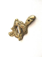 Antique brass keyhole cover. Ornamental escutcheon, cabinet hardware, furniture applique.