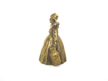 Vintage brass table bell, woman with milk jugs.