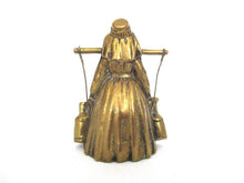 Vintage brass table bell, woman with milk jugs.