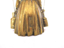 Vintage brass table bell, woman with milk jugs.