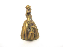 Vintage brass table bell, woman with milk jugs.