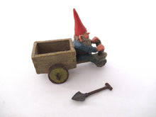 'Thomas' Gnome riding a cargo bike with shovel. Gnome figurine after a design by Rien Poortvliet. Classic Gnomes series. AAAAAAA International Co. Ltd.