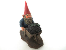 Classic Gnomes 'Christian' after a design by Rien Poortvliet. Gnome figurine transporting grapes with a wheelbarrow.