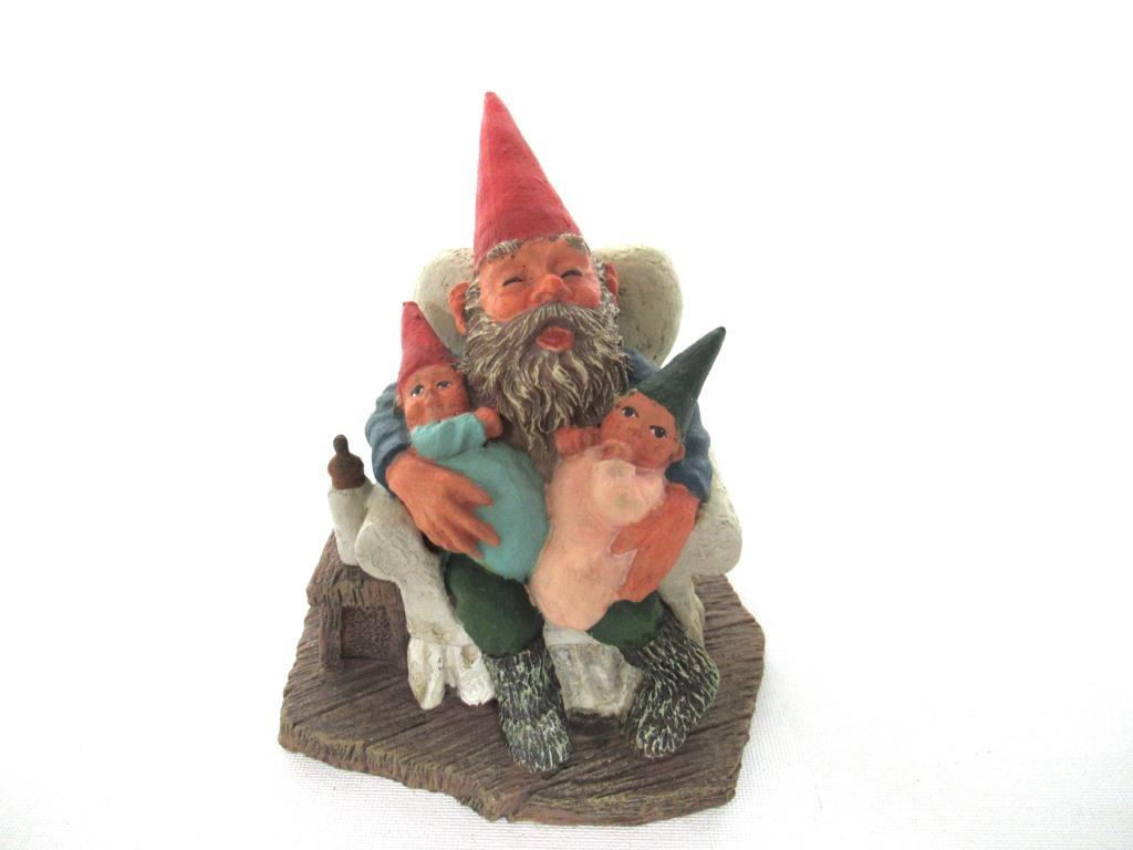 Gnome with grandchildren sitting in a chair figurine. 'Grandfather with Children' Part of the Classic Gnomes series designed by Rien Poortvliet