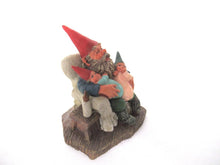Gnome with grandchildren sitting in a chair figurine. 'Grandfather with Children' Part of the Classic Gnomes series designed by Rien Poortvliet