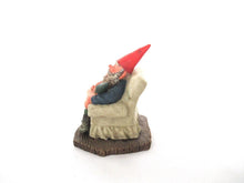 Gnome with grandchildren sitting in a chair figurine. 'Grandfather with Children' Part of the Classic Gnomes series designed by Rien Poortvliet