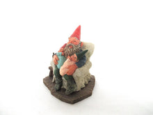 Gnome with grandchildren sitting in a chair figurine. 'Grandfather with Children' Part of the Classic Gnomes series designed by Rien Poortvliet