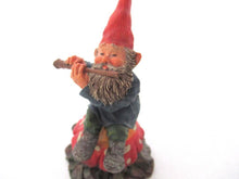 Gnome 'Mo on Mushroom' after a design by Rien Poortvliet, Gnome playing a flute.