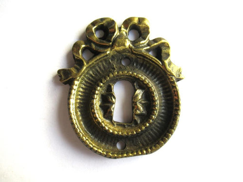 Antique Bow Escutcheon, Solid Brass, Keyhole Cover.