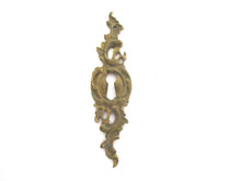 1 (ONE) Antique ornate brass keyhole cover. Ornamental escutcheon, cabinet hardware, furniture applique.
