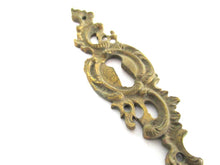 1 (ONE) Antique ornate brass keyhole cover. Ornamental escutcheon, cabinet hardware, furniture applique.
