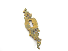1 (ONE) Antique ornate brass keyhole cover. Ornamental escutcheon, cabinet hardware, furniture applique.