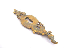 1 (ONE) Antique ornate brass keyhole cover. Ornamental escutcheon, cabinet hardware, furniture applique.