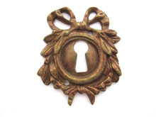 1 (ONE) Escutcheon, Laurel, bow, embellishment, Empire Solid brass, keyhole cover, Restoration hardware.