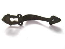 Cabinet Pull including keyhole cover, escutcheon.