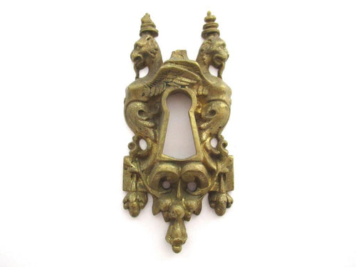 Antique Brass escutcheon, Keyhole Cover, Griffin, ornament, embellishment (3 15/16 inches).