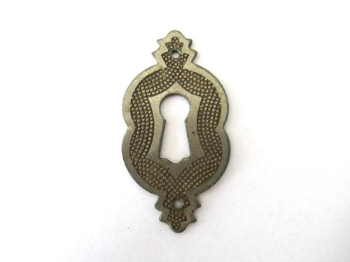 Vintage metal Escutcheon.