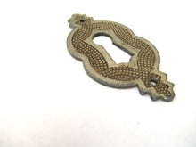 Vintage metal Escutcheon.