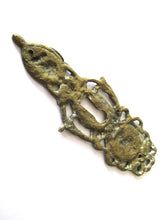 Ornate brass escutcheon, cabinet hardware, furniture applique.