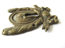 Escutcheon, bow, keyhole cover, Restoration hardware.