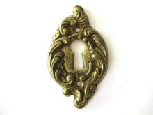 Brass escutcheon, keyhole cover.