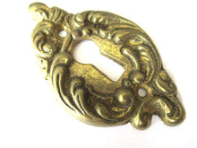 Brass escutcheon, keyhole cover.