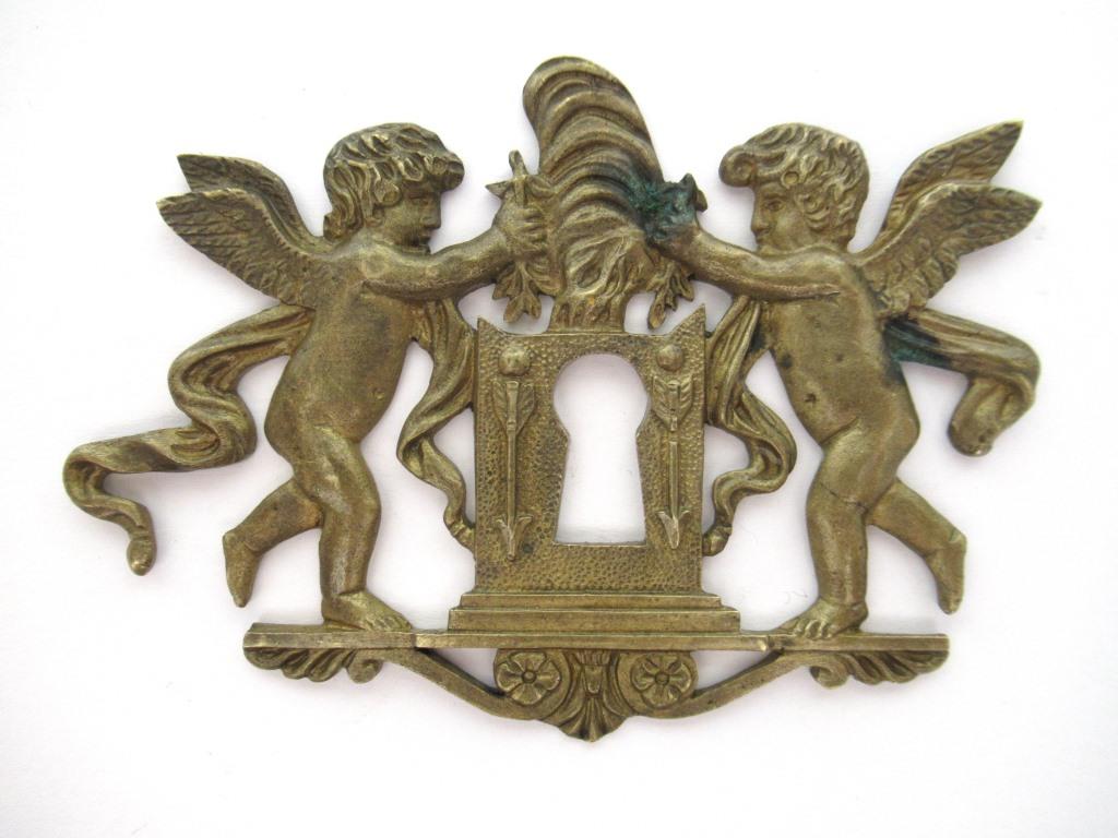 Antique Brass keyhole cover, ornament, embellishment, putti, cherub, angel.