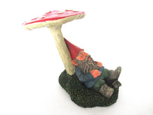 Gnome sleeping under a mushroom. 'Slumber Chief' a design by Rien Poortvliet.