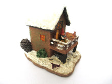 Gnome Villages 'House with Wren' after a design by Rien Poortvliet, feeding bird.
