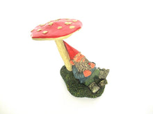 Gnome sleeping under a mushroom. 'Slumber Chief' a design by Rien Poortvliet.