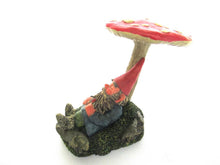 Gnome sleeping under a mushroom. 'Slumber Chief' a design by Rien Poortvliet.