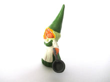 Gnome figurine in Green dress after a design by Rien Poortvliet, Brb Gnome cooking, Lisa the Gnome with cooking pan.