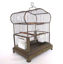 UpperDutch:,Antique German Bird Cage with porcelain feeders and glass panels on both sides.