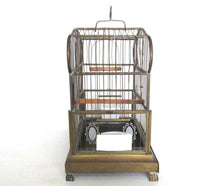 UpperDutch:,Antique German Bird Cage with porcelain feeders and glass panels on both sides.