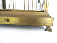 UpperDutch:,Antique German Bird Cage with porcelain feeders and glass panels on both sides.