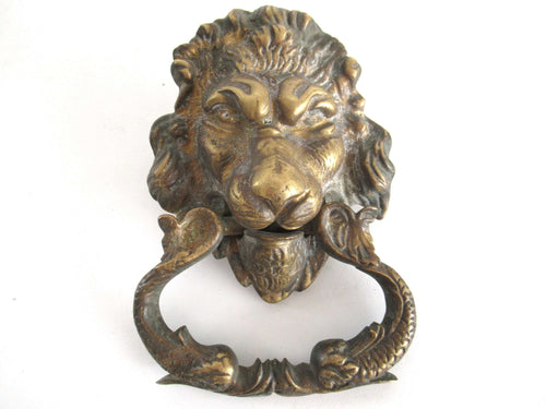 UpperDutch:Door knocker,Antique Solid Brass Detailed Lion Head Door Knocker with fish / carp handle.
