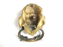 UpperDutch:Door knocker,Antique Solid Brass Detailed Lion Head Door Knocker with fish / carp handle.