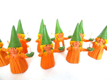 UpperDutch:,1 (ONE) Gnome figurine, Gnome after a design by Rien Poortvliet, Brb Gnome holding candle, Lisa the Gnome. Orange Pajamas