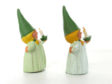 UpperDutch:,1 (ONE) Gnome figurine, Gnome after a design by Rien Poortvliet, Holding a candle, Lisa the Gnome. Green night gown, Pajamas. BRB