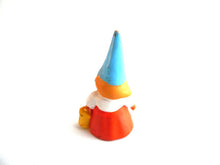 UpperDutch:,1 (ONE) Gnome figurine in orange dress, Gnome after a design by Rien Poortvliet, Brb Gnome, Lisa the Gnome carrying a bucket.