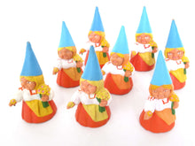 UpperDutch:,1 (ONE) Gnome with flowers figurine in orange dress, Gnome after a design by Rien Poortvliet, Brb Gnome.