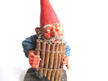 UpperDutch:,'Andreas' Gnome playing pan flute figurine after a design by Rien Poortvliet. Part of the Classic Gnomes series designed by Rien Poortvliet