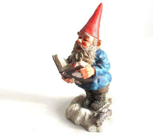 UpperDutch:,'Arthur' Reading, singing Gnome figurine. Classic gnomes series by AAAAAAA International Co. Ltd. Designed by Rien Poortvliet.