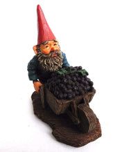 UpperDutch:Gnome,'Christian' Gnome figurine transporting grapes with a wheelbarrow.  Classic gnomes series after a design by Rien Poortvliet.