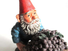 UpperDutch:,Classic Gnomes 'Christian' after a design by Rien Poortvliet. Gnome figurine transporting grapes with a wheelbarrow.